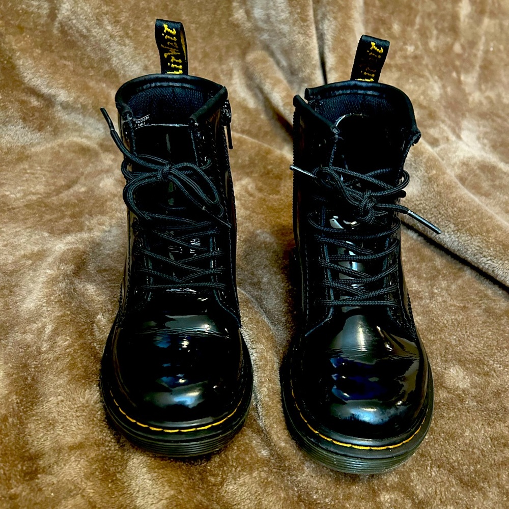 Used Dr. Martens, size 12 girls. Black, patent leather
